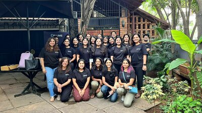 Group of women team members at Blume posing outdoors together in coordinated T-shirts