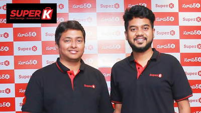 Image showing Anil Thontepu, and Neeraj Menta, co-founders of SuperK, standing in front of a backdrop with SuperK branding