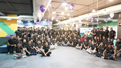 Image showing a large group of people from Locus posing together indoors with balloons