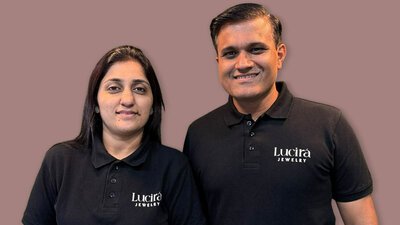 Image showing Vandana Jain, and Rupesh Jain, co-founders of Lucira, standing together wearing black shirts with Lucira branding